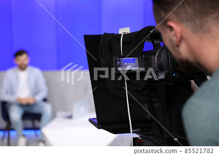 Professional video camera operator working in studio, closeup Professional video camera operator working in studio, closeup 85521782