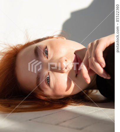 Young white european woman on the floor Young white european woman on the floor 85522360