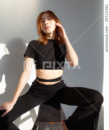Young white european woman background in shadows Young white european woman background in shadows 85522362