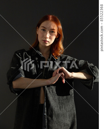 Young white european woman isolated on black Young white european woman isolated on black 85522368