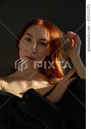 Young white european woman isolated on black 85522371
