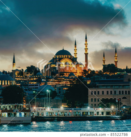 Suleymaniye Mosque with lights in the evening with dramatic clouds in Istanbul skyline, Turkey 85522786