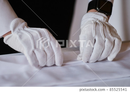 Restaurant personnel preparing the fine dining table. Restaurant personnel preparing the fine dining table. 85525541