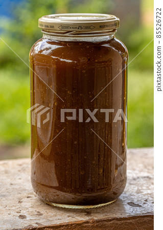 Itaja, Goias, Brazil - 12 24 2021: Mangaba candy paste in a glass 85526722