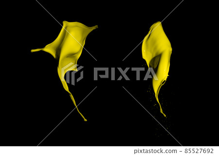 Yellow paint splashes, isolated on black background Yellow paint splashes, isolated on black background 85527692