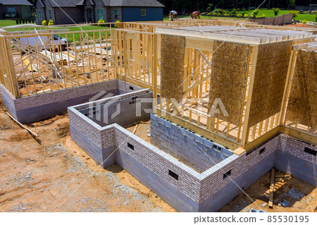 Aerial view the construction wood framing beams of a new house under construction 85530195