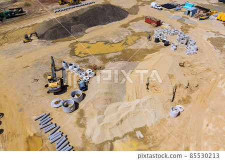 Preparation construction site for concrete sewer piles on a stacking pipes for sewer systems Preparation construction site for concrete sewer piles on a stacking pipes for sewer systems 85530213