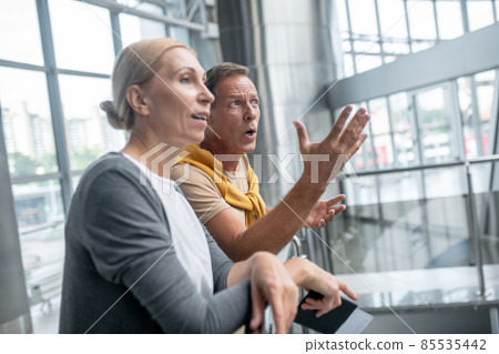 Couple of tourists staring at something in the distance 85535442