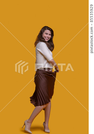 Cheerful stylish cute woman enjoying her dance Cheerful stylish cute woman enjoying her dance 85535929