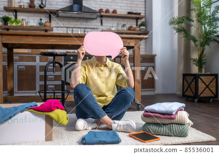 Mysterious woman calling for donating unwanted clothes to charity 85536001
