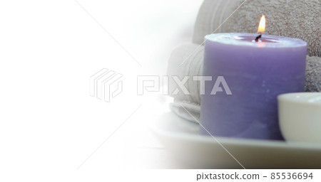 Image of white background over towels and candle Image of white background over towels and candle 85536694