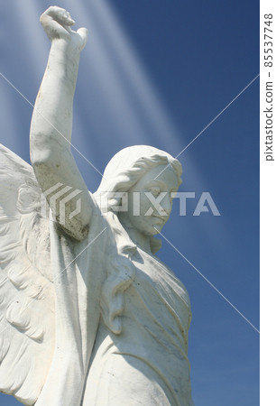 Historic Angel Statue With Blue Sky and Light Beams Historic Angel Statue With Blue Sky and Light Beams 85537748