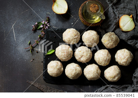Homemade turkey meatballs raw on slate blackboard. Top view flat lay. Free space for your text. Homemade turkey meatballs raw on slate blackboard. Top view flat lay. Free space for your text. 85539041