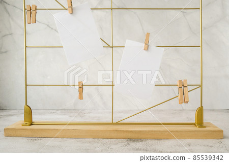 Cards and posters mock ups on grid board. Copy space. Feminine hipster office table decoration. Home office desktop. Freelance bloggers workplace 85539342