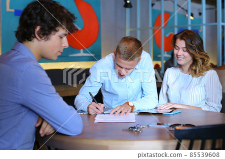 Young couple buy apartment with realtor contract 85539608