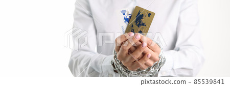 Female tied hands with plastic credit bank cards chain closeup 85539841