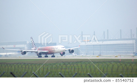 MUNICH, GERMANY - 11 OCTOBER 2015: Etihad Airways Airbus A340 take off at airport MUNICH, GERMANY - 11 OCTOBER 2015: Etihad Airways Airbus A340 take off at airport 85540752