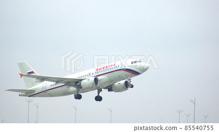 MUNICH, GERMANY - 11 OCTOBER 2015: Airbus A319-111 of Rossiya takes off from Munich MUC airport MUNICH, GERMANY - 11 OCTOBER 2015: Airbus A319-111 of Rossiya takes off from Munich MUC airport 85540755