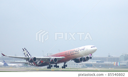 MUNICH, GERMANY - 11 OCTOBER 2015: Etihad Airways Airbus A340 take off at airport 85540802