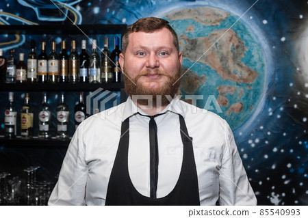 Bearded Adult Caucasian Looking Professional Bartender Portrait in Nightclub Bearded Adult Caucasian Looking Professional Bartender Portrait in Nightclub 85540993
