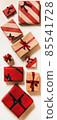 Festive gift boxes in wrapping paper for 85541728
