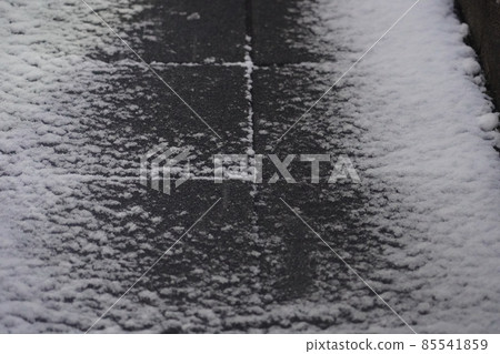 Snow that has begun to pile up on the road Snow that has begun to pile up on the road 85541859