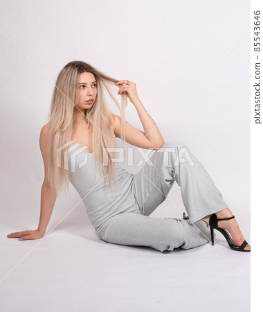 Young white european woman on grey Young white european woman on grey 85543646