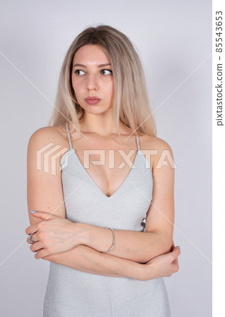 Young white european woman on grey Young white european woman on grey 85543653