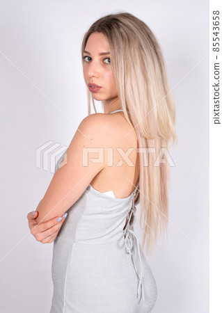 Young white european woman on grey Young white european woman on grey 85543658