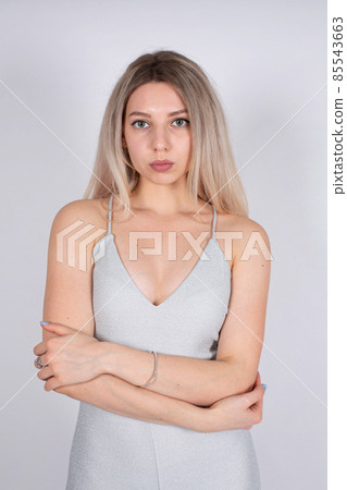 Young white european woman on grey Young white european woman on grey 85543663