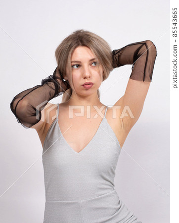 Young white european woman on grey Young white european woman on grey 85543665