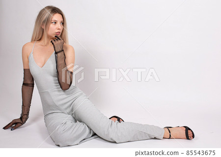 Young white european woman on grey Young white european woman on grey 85543675