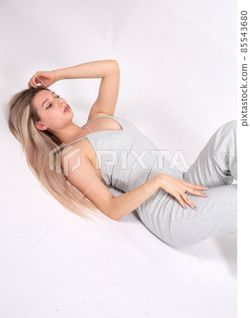 Young white european woman on grey Young white european woman on grey 85543680