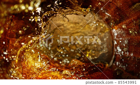 Freeze motion of splashing whisky in barrel Freeze motion of splashing whisky in barrel 85543991