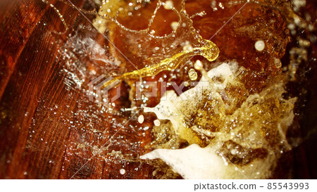 Freeze motion of splashing whisky in barrel Freeze motion of splashing whisky in barrel 85543993
