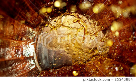 Freeze motion of splashing whisky in barrel Freeze motion of splashing whisky in barrel 85543994
