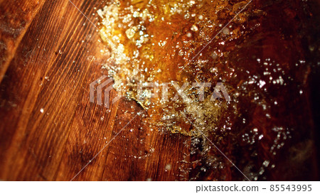 Freeze motion of splashing whisky in barrel Freeze motion of splashing whisky in barrel 85543995