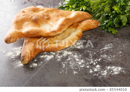 Traditional national Georgian Shoti bread close up. Horizontal Traditional national Georgian Shoti bread close up. Horizontal 85544010
