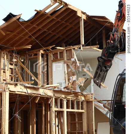 Demolition work site demolition vacant lot real estate housing rebuilding demolition work site heavy machinery construction work chipping 85544023