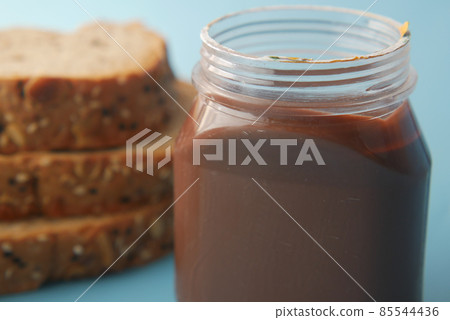 Chocolate Hazelnut cream in a container on table  85544436