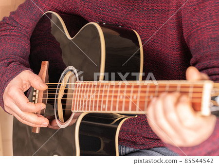 man playing guitar man playing guitar 85544542