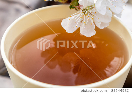 Warm mood sunny cup spring flowers flavored tea 85544982