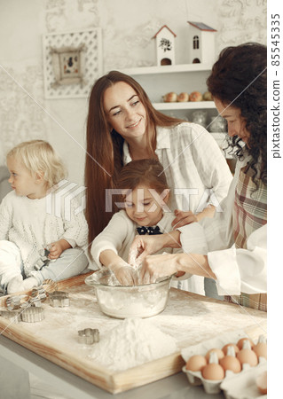 Family cook the dough for cookies 85545335