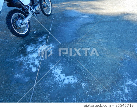 Frozen puddle in the parking lot 85545712