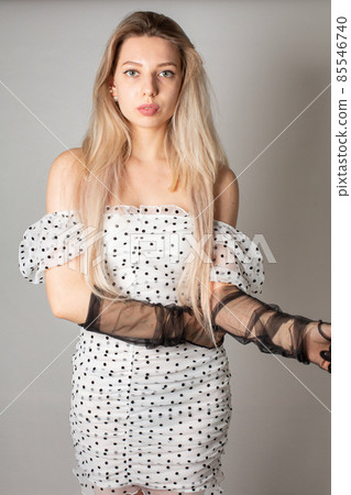 Young white european woman isolated on dark grey 85546740