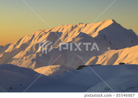 Snowy mountain at sunset Tateyama Snowy mountain at sunset Tateyama 85546987
