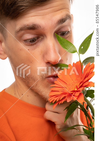 Young man with flower on white 85547986