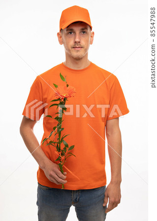 Young man with flower on white Young man with flower on white 85547988