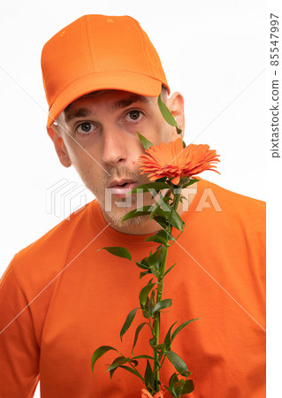 Young man with flower on white Young man with flower on white 85547997