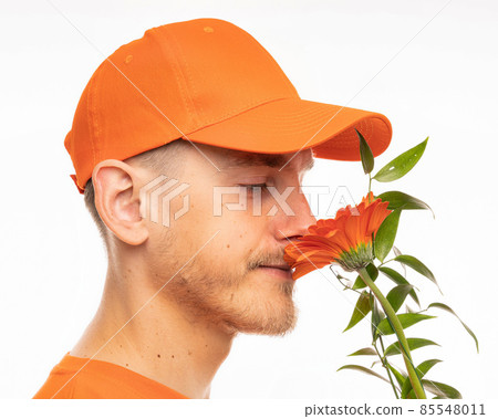 Young man with flower on white Young man with flower on white 85548011